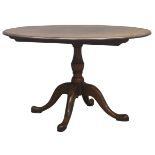 20th century circular medium oak pedestal table, single turned column, four splayed supports,