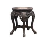 Chinese Padouk wood low Jardiniere stand, shaped circular top with marble inset on curved supports,