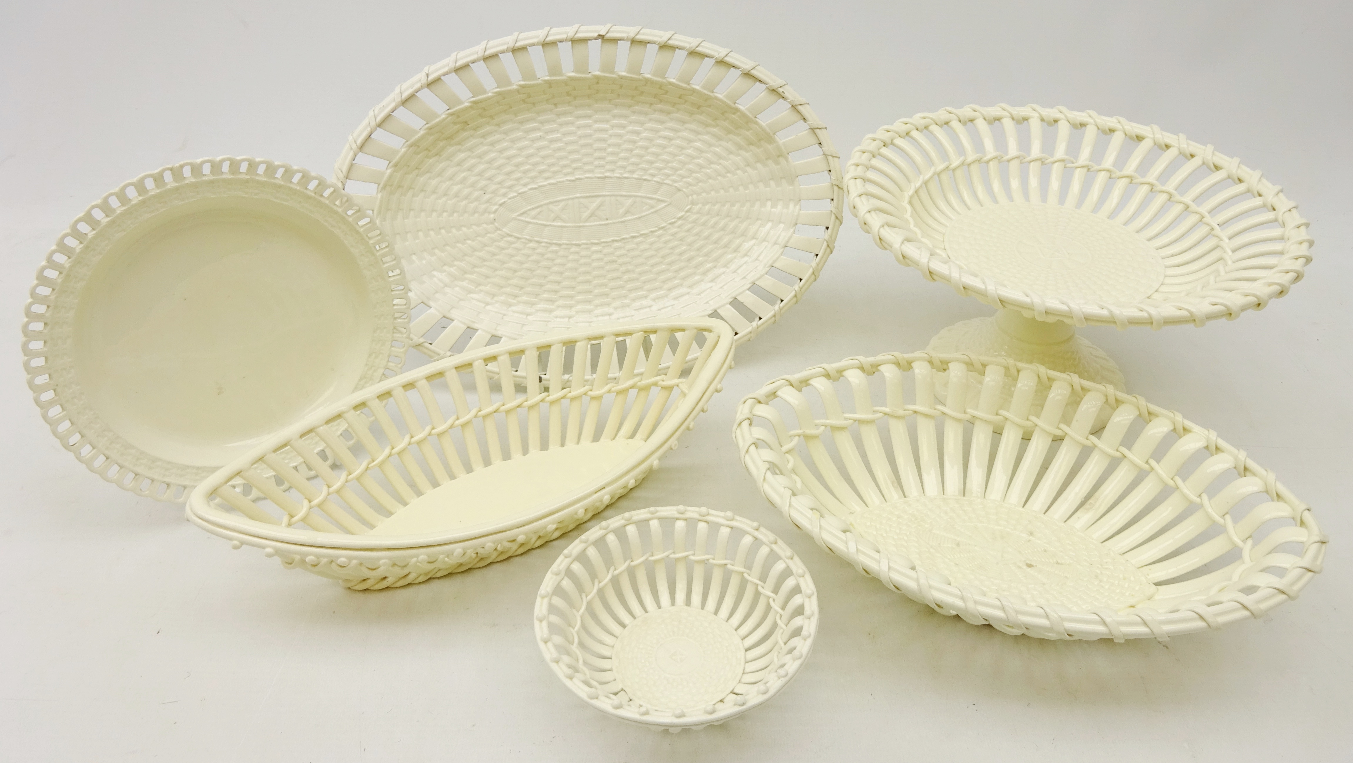 19th century and later creamware comprising a Creil oval stand with pierced border and 'basketry'