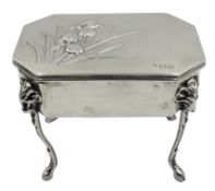 Edwardian silver dressing table jewellery box, the hinged lid embossed with Iris decoration,