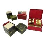 Early 20th century leather cased games set comprising two packs of cards and two whist makers with