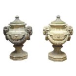 Pair of stone octagonal Garden Urns, the covers dated 1870,