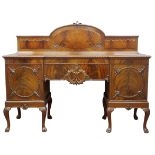 Early 20th century figured mahogany inverted break front sideboard with raised and carved back,