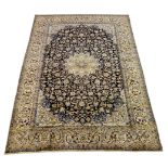 Persian Nain carpet, floral design on dark blue field, central rosette medallion,