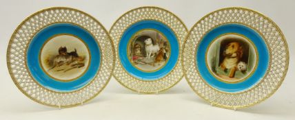 Set of three late Victorian Minton cabinet plates hand painted with Dog groups after Edwin Landseer,