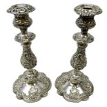 Pair 19th century silver-plated candlesticks allover embossed with stylised foliate and scrolls,