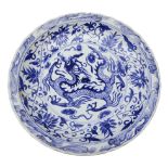 Chinese blue & white circular waved edge dish, decorated with three clawed Dragon Chasing Pearl,