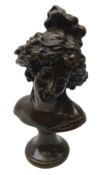 Patinated bronze bust of a maiden on waisted plinth,