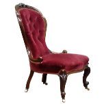 Victorian walnut framed Nursing chair, upholstered in red velvet,