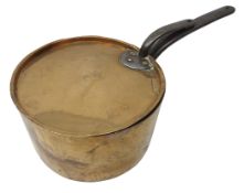 Large Victorian copper saucepan with lid, stamped with Coronet over C, cast iron handles, L62cm,