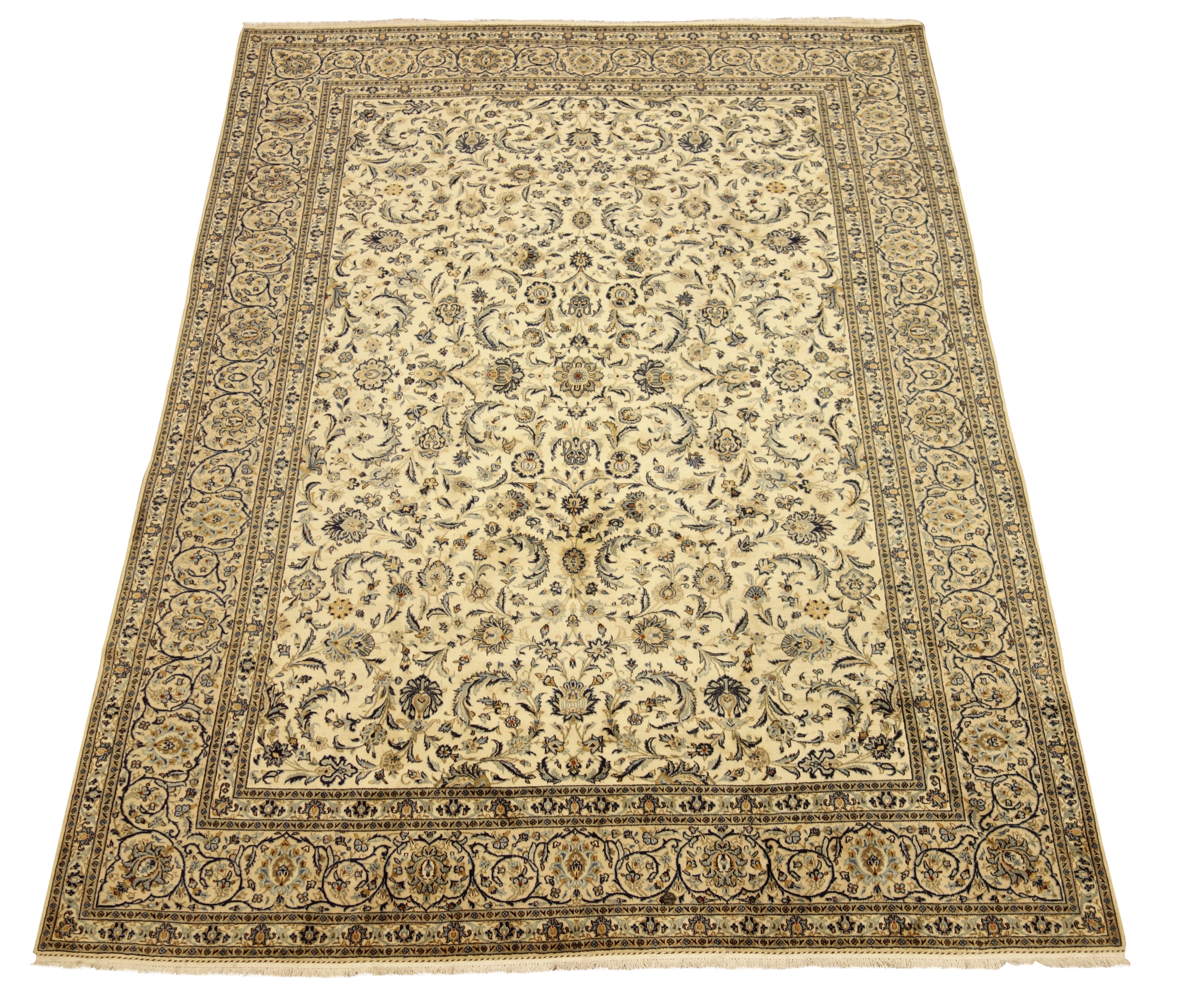 Persian Kashan carpet, ivory ground with blue interlacing overall design, repeating scroll border,