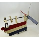 Folkart red & white painted Whirligig Weathervane, the four blades turned by a man in a Hat,