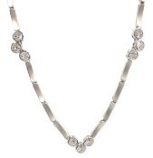 Brushed white gold necklace set with nine round brilliant cut diamonds,
