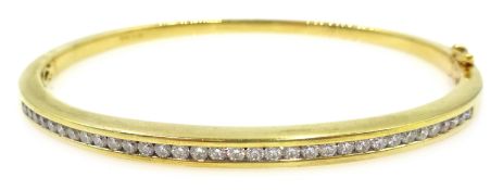 Channel set diamond gold hinged bangle, hallmarked 18ct Condition Report Approx 18.