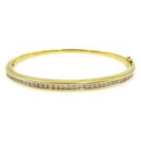 Channel set diamond gold hinged bangle, hallmarked 18ct Condition Report Approx 18.