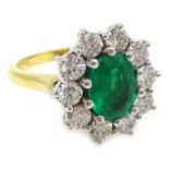 Emerald and diamond cluster ring, hallmarked 18ct Condition Report Emerald 0.8cm x 0.