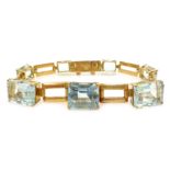 Graduating emerald cut aquamarine 18ct gold link bracelet Condition Report Gold