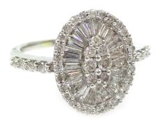White gold diamond and baguette diamond mirror cluster ring, with diamond set shoulders,