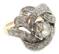 18ct gold diamond scroll ring, central old cut diamond approx 0.