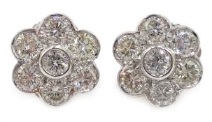 Pair of 18ct white gold flower head stud ear-rings,