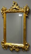 Ornate gilt wall mirror, acanthus leaf and scrolled decorated frame, bevelled glass,