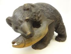 Black Forest style carved softwood model of a Bear with Salmon catch,