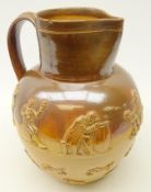 Large Doulton Lambeth stoneware harvest jug of bulbous form applied with hunting and toping scenes