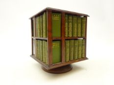 Edwardian mahogany revolving bookcase, containing The Complete Works of Shakespeare in miniature,