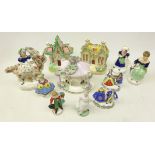 Group of Victorian Staffordshire comprising Pastille burner, money box and cottage,