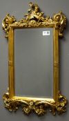 Ornate gilt wall mirror, acanthus leaf and scrolled decorated frame, bevelled glass,
