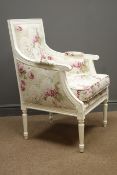 Cream painted French style armchair upholstered in floral fabric, turned and fluted supports,