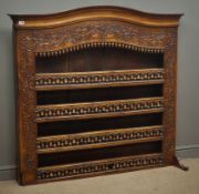 19th century walnut Delft rack, arched moulded projecting cornice, floral, acorn and bell carvings,