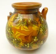 Linthorpe two handled vase, painted with berries and foliage on mustard ground,