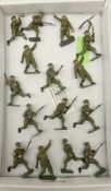Fifteen Britains 'Soldiers in Action' cast metal figures, some wearing gas masks, grenade throwing,