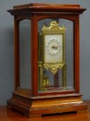 Early 20th century mahogany and bevelled glass cased torsion clock by 'Gustav Becker',