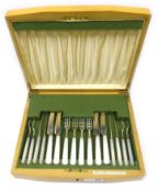 Set of eight silver and mother of pearl hors d'oeuvres knives and forks by Reid & Sons Ltd,