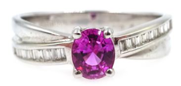 White gold oval pink sapphire ring, with baguette diamond cross over shoulders, hallmarked,