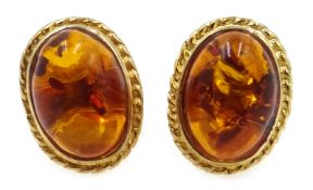 Pair of 9ct gold (tested) Baltic amber stud ear-rings Condition Report length 0.