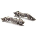 Pair of hallmarked silver model foxes, ruby eyes by G W Lewis & Co,