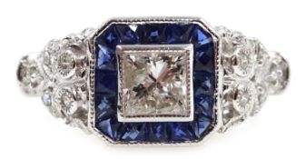 White gold princess cut diamond ring, with sapphire and diamond surround,