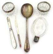 Silver table spoon, ladies cut glass hip flask, pair cut glass salts with silver rims,