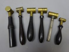 Two James Dixon & Sons brass shot/powder measures stamped 1103 and 1108 with ebony handles and