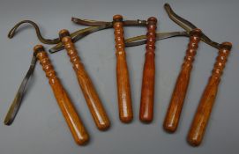 City of London Policewomans turned wooden Truncheons, variously stamped, with leather wrist straps,
