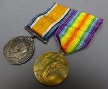 WWI medal pair comprising victory and war medal, named to 'Rev. W.