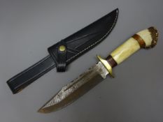 Hunting knife, 19cm Damascus decorated single edge steel blade with brass cross,