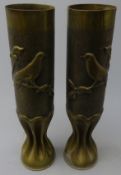 Pair of Trench Art brass vases, decorated with birds on branches and fluted bases, stamped 75 DEC,