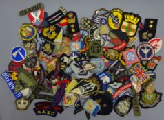 Collection of military cloth badges including Commando, Parachute, naval, USA, German etc, approx.