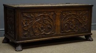 19th century carved oak chest, front carved with trailing foliage and flower head,