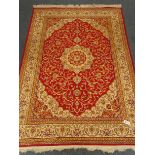 Kashan style red ground rug, repeating border,