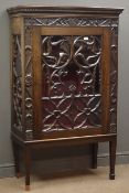 Early 20th century oak display cabinet, projecting cornice with dentil detailing,